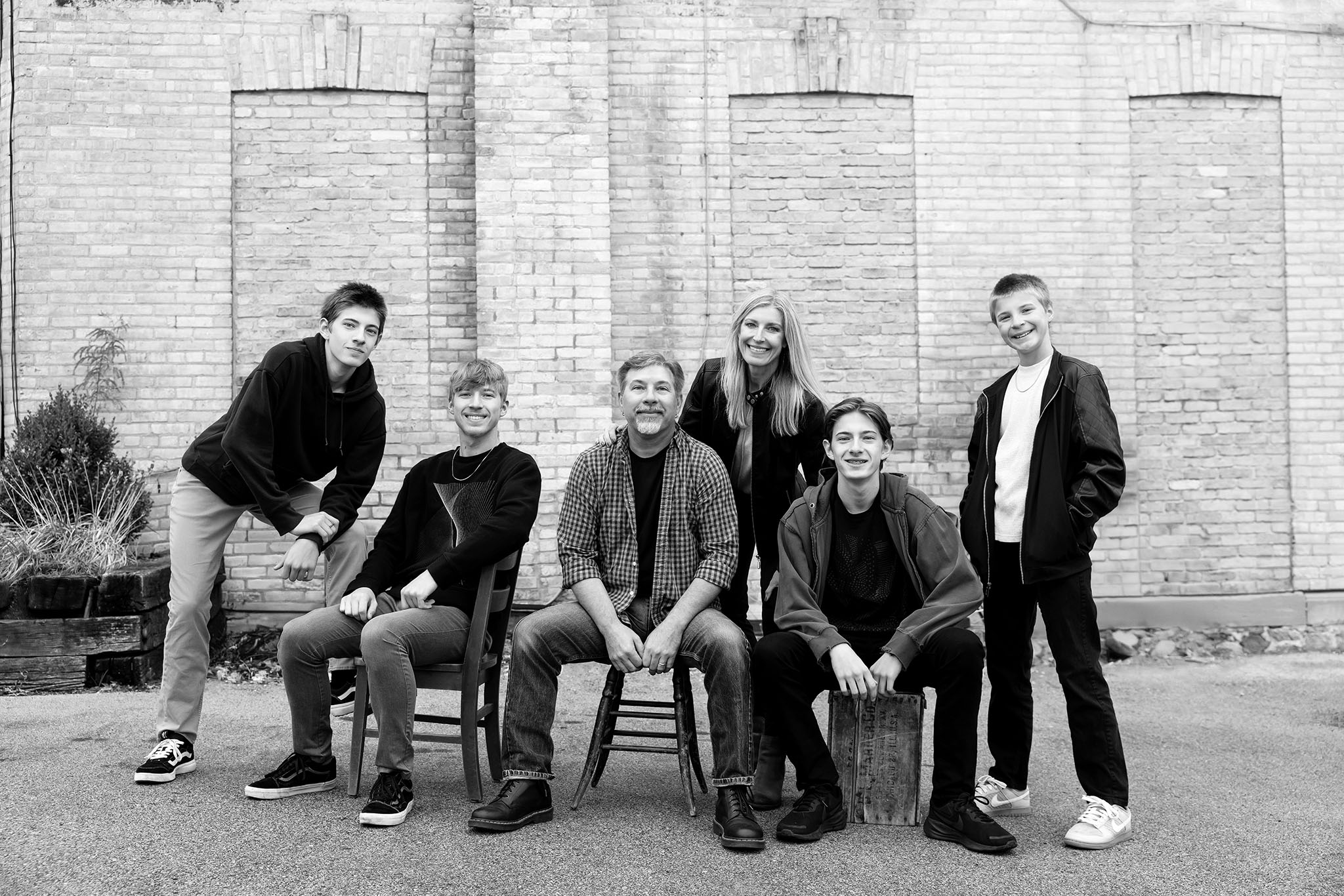 1226_BW_WEB Family of six, four boys in an urban setting downtown Oconomowoc with Julie Collins Photography